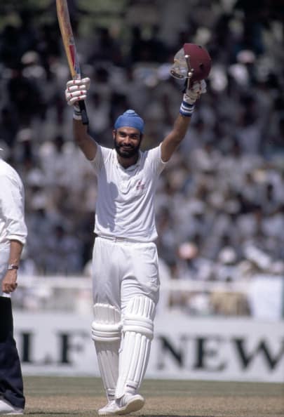 Indian batsman Navjot Sidhu celebrates as he reaches his century against Pakistan during a Champions Trophy match at Sharjah Stadium in the United Arab Emirates on 15th October 1989.  Pakistan won by six wickets.   (Photo by David Munden/Popperfoto/Getty Images)
