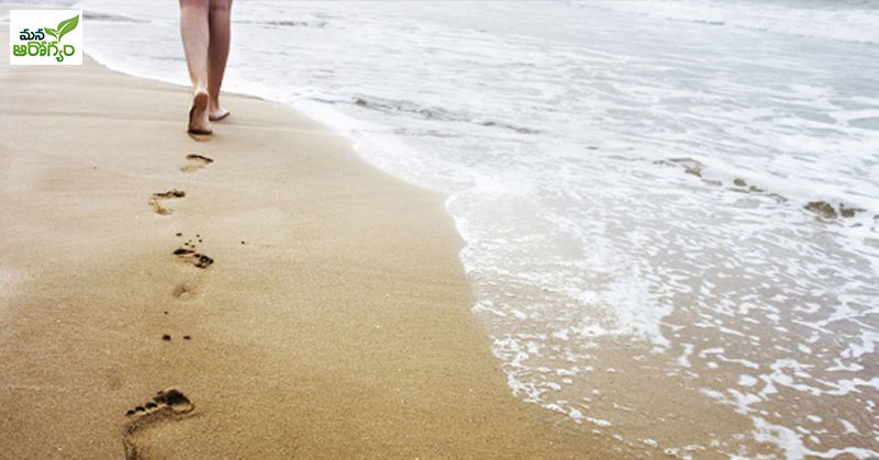 What are the benefits of walking in the sand?