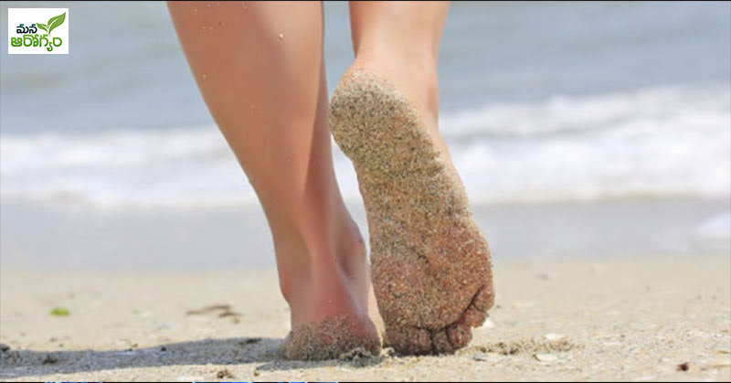 What are the benefits of walking in the sand?